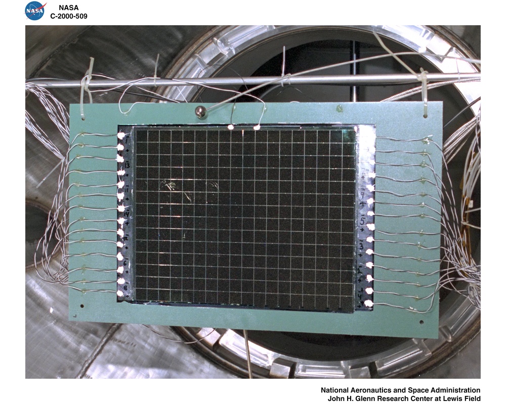 DAMAGED TEST SAMPLE WITH HIGH VOLTAGE IN A VACUUM CHAMBER