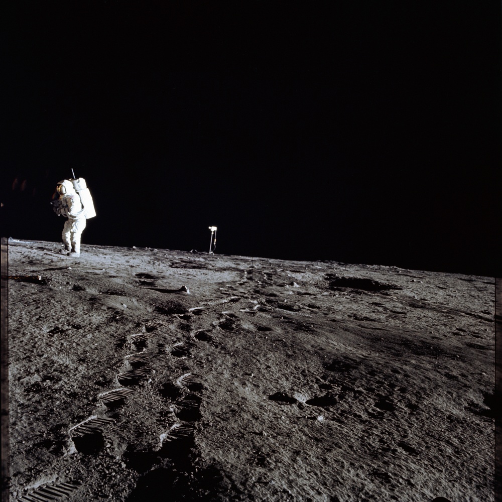 Apollo 12 Mission image  - Photo of Al Bean and the TV taken from just inside the rim of Surveyor Crater