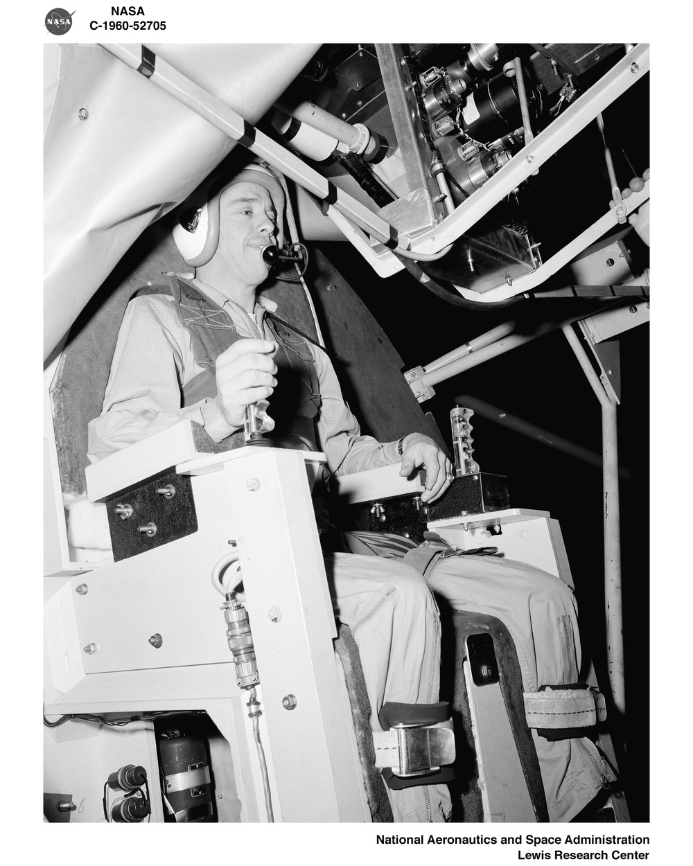 PROJECT MERCURY ASTRONAUTS VIRGIL GUS GRISSOM AND ALAN B SHEPARD JUNIOR AT THE NASA LEWIS RESEARCH CENTER ALTITUDE WIND TUNNEL AWT GIMBALING RIG