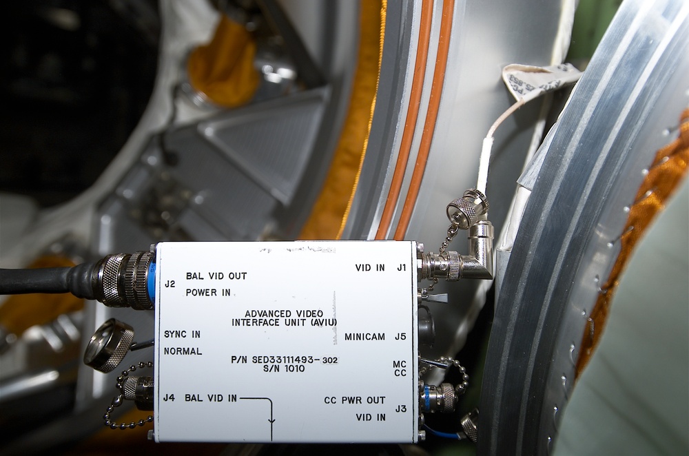 Video cables and a wiring diagram in the Zarya FGB taken during Expedition Four