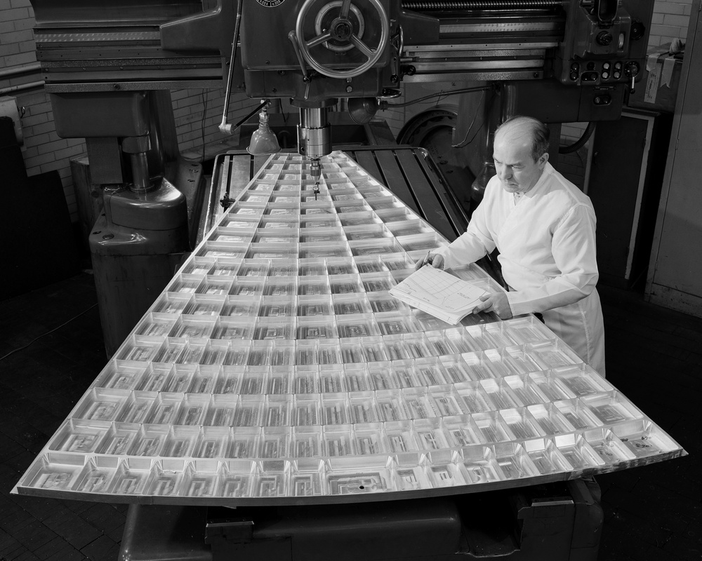 SOLAR MIRROR SEGMENT BEING INSPECTED IN JIG BORE ROOM OF THE TECHNICAL SERVICES BUILDING TSB