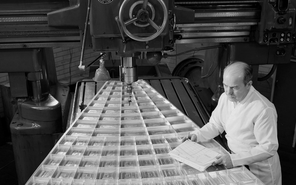 SOLAR MIRROR SEGMENT BEING INSPECTED IN JIG BORE ROOM OF THE TECHNICAL SERVICES BUILDING TSB