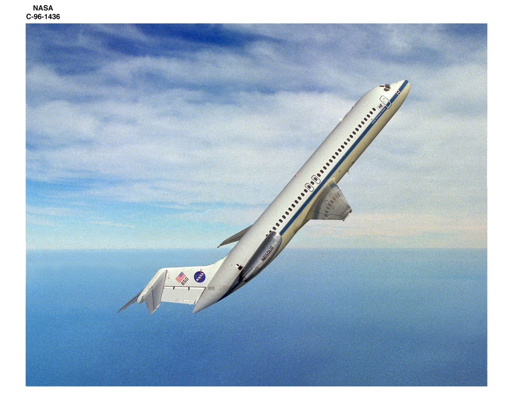 DC-9 AIRPLANE IN FLIGHT AT 50 DEGREES ANGLE OVER HORIZON