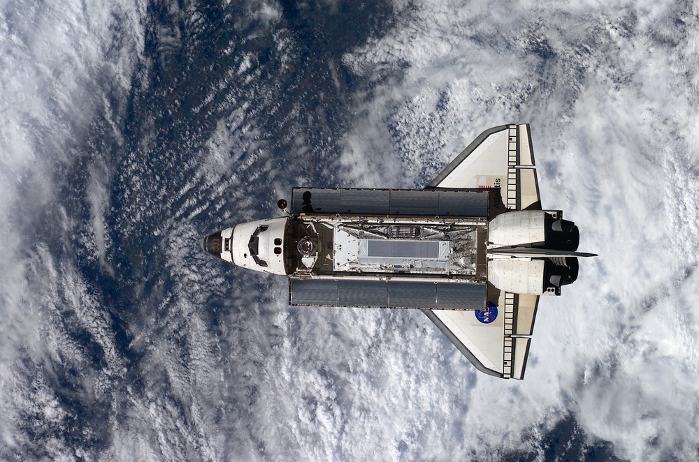 Shuttle Atlantis on approach for docking to the ISS during STS-110 and Expedition Four