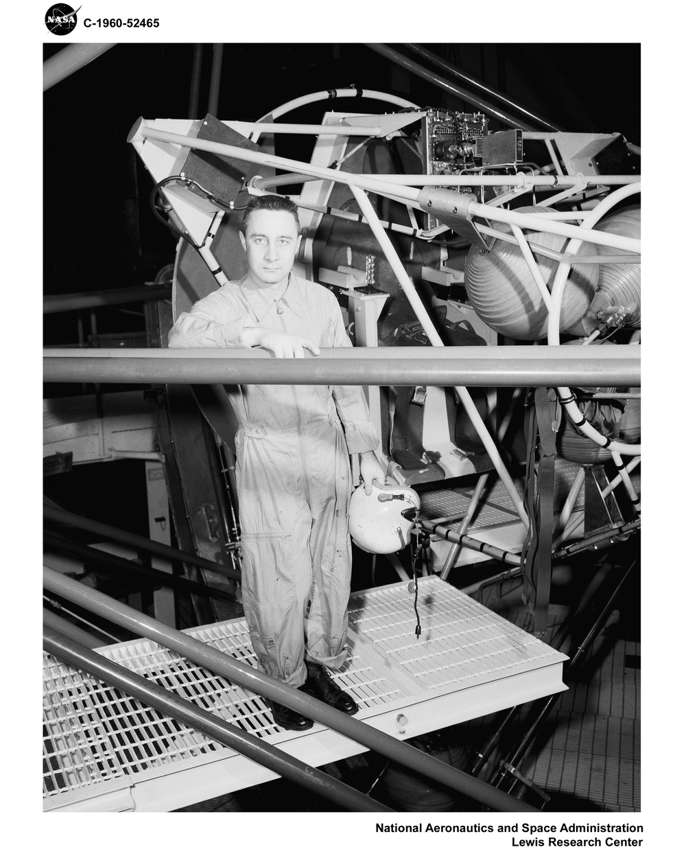 PROJECT MERCURY - ASTRONAUT CAPTAIN GUS GRISSOM IN THE ALTITUDE WIND TUNNEL AWT GIMBAL RIG