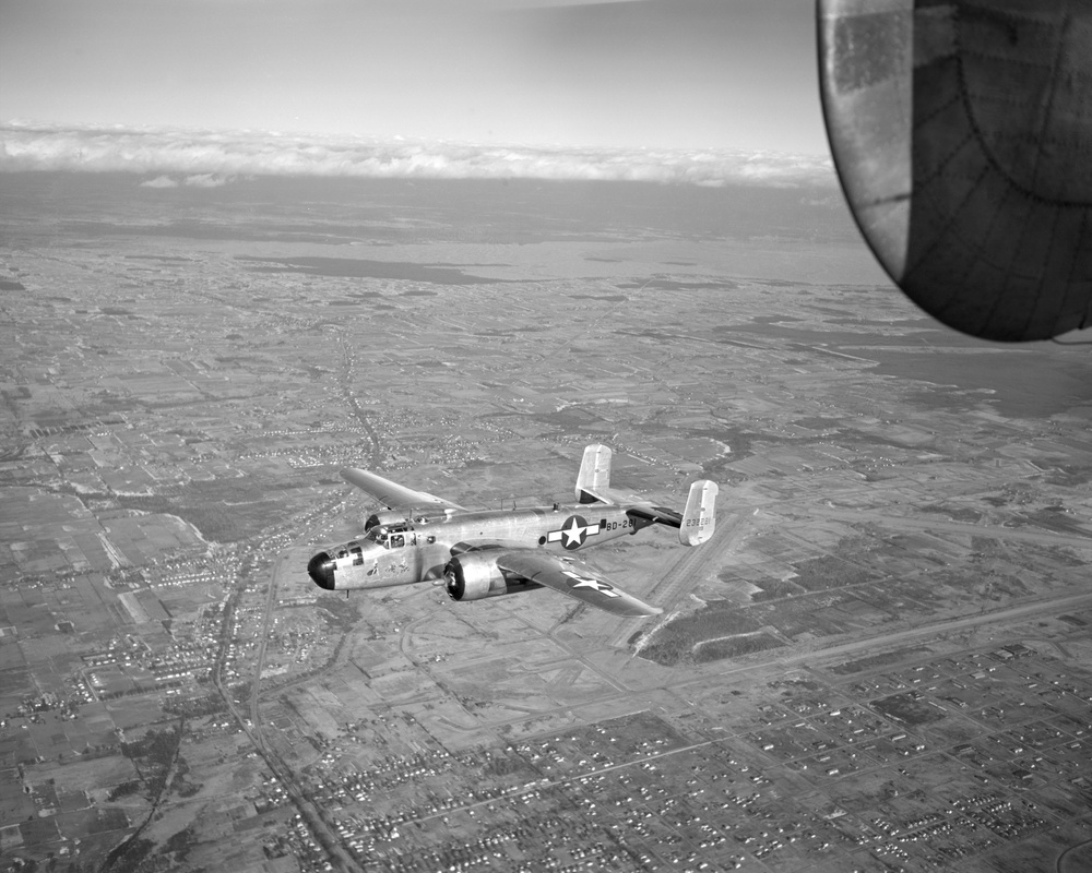 B-25 AIRPLANE FLIGHT TEST SHOWING DE-ICING EQUIPMENT AND RESEARCH INSTALLATIONS