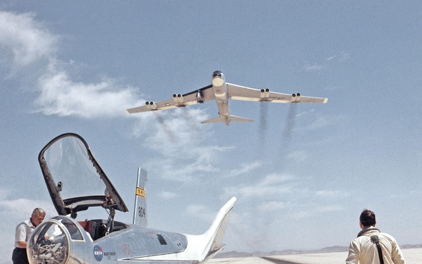 HL-10 on Lakebed with B-52 Flyby