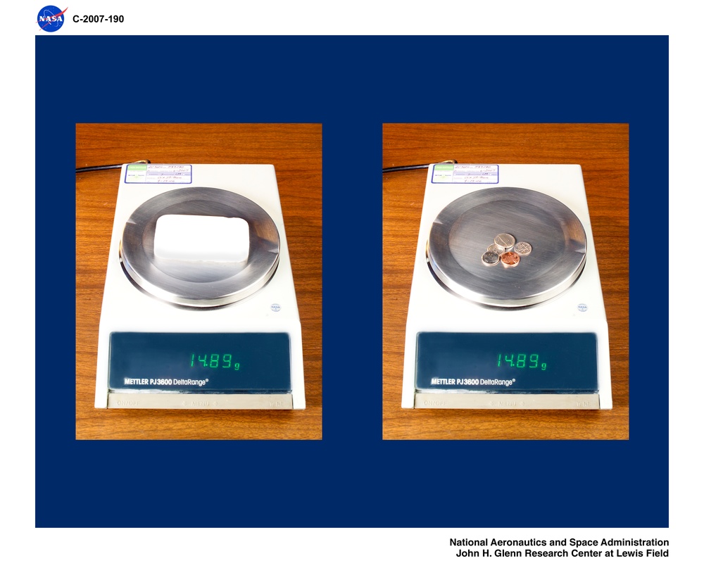 Comparison of the weight between an Aerogel material sample and a collection of 3 dimes, 1 nickle and 1 penny