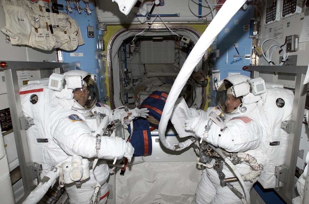 Bursch and Walz prebreathe OPS for EVA 3 in the Quest Airlock, Expedition Four