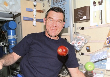 Voss in Service Module with apples