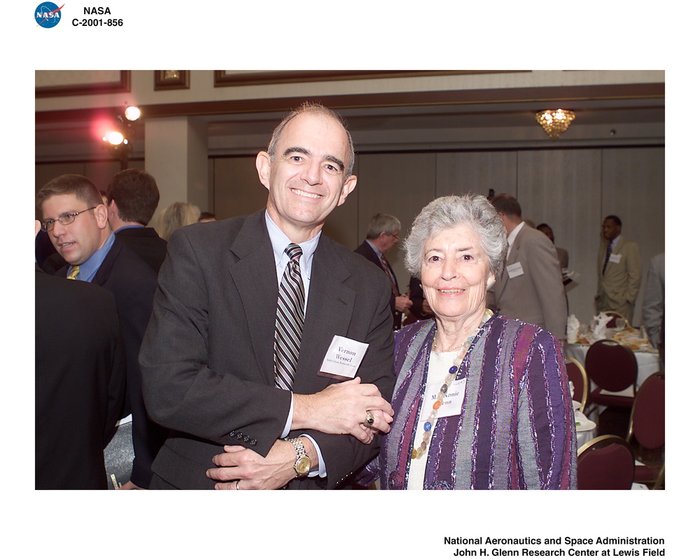 VERNON WESSEL AND ANNIE GLENN DURING THE GREATER CLEVELAND GROWTH ASSOCIATION MEETING