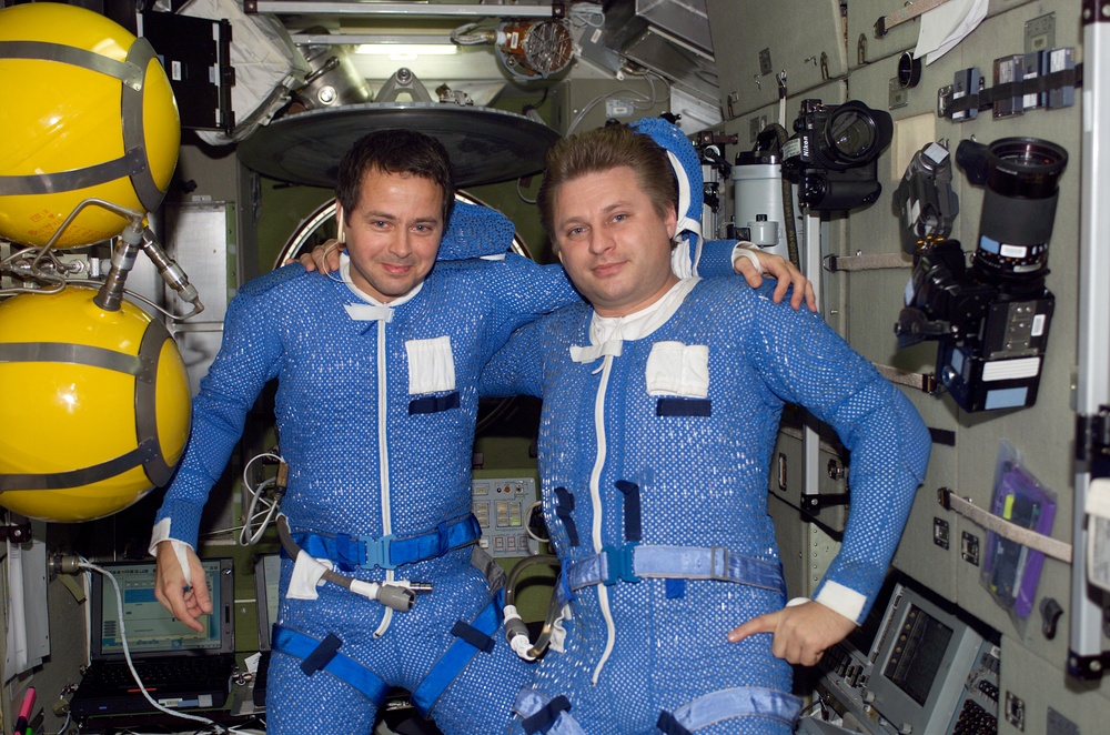 Bursch and Onufrienko in LCVGs during EVA 2 suitup in the Zvezda SM,  Expedition Four