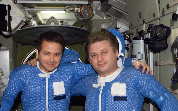 Bursch and Onufrienko in LCVGs during EVA 2 suitup in the Zvezda SM,  Expedition Four