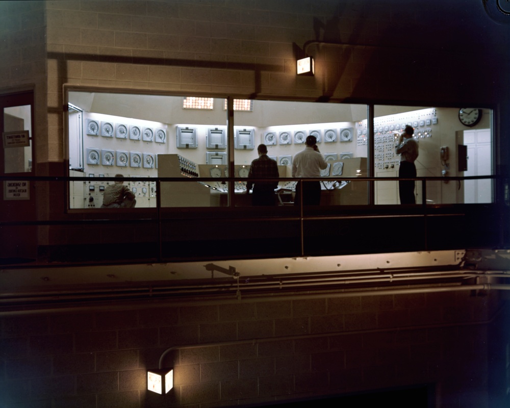 REACTOR VIEW SHOWING CONTAINMENT VESSEL AND CONTROL ROOM WITH MEN WORKING ON THERMOCOLUM FOR QUADRANT B AT NASA PLUM BROOK STATION