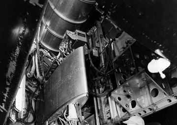 TG-180 ENGINE IN B-29 AIRPLANE IN PROCESS OF DISASSEMBLY