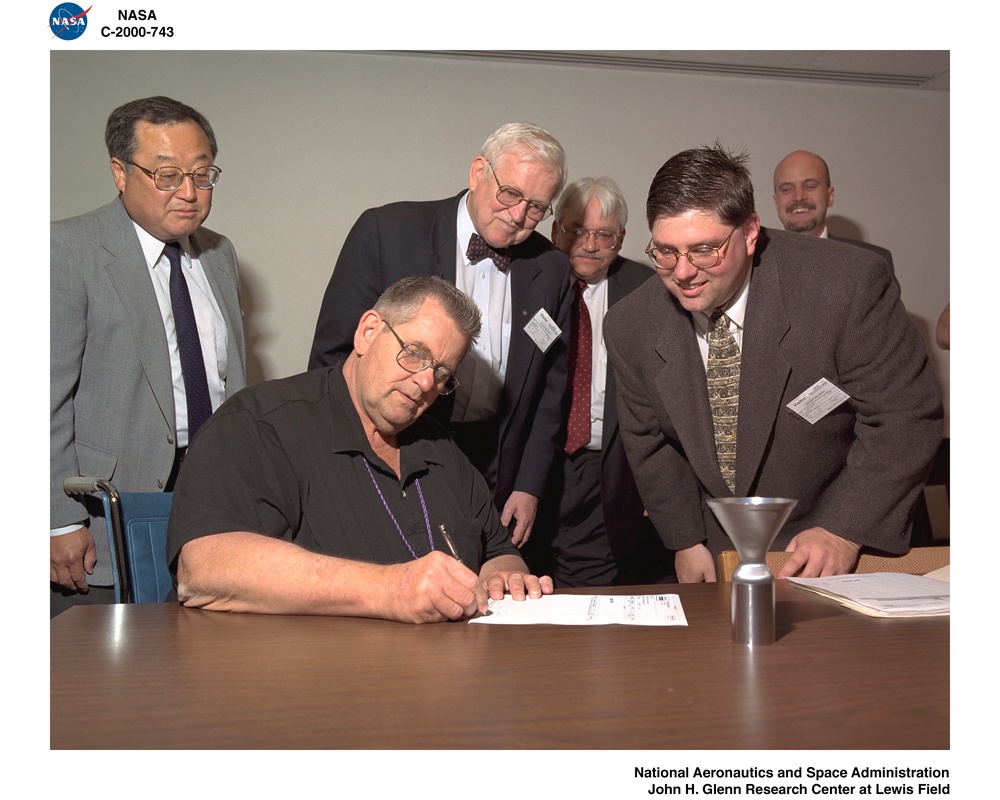 RHENIUM ALLOY ROCKET MOTOR SIGNING AGREEMENT TO NASA GLENN RESEARCH CENTER WITH WALTER KIM / JAN CARLEN - SEATED / MARK HAMISTER  / TODD LEONHARDT