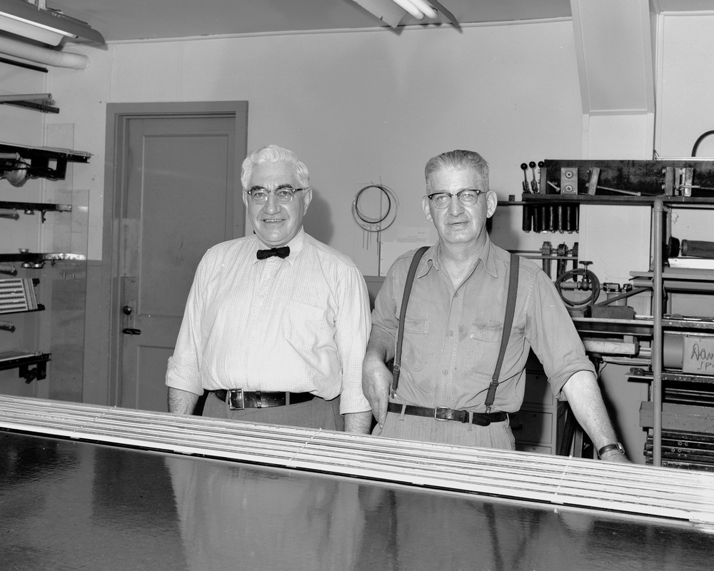 MR SIODLA AND MR DAVENPORT AT MANOMETER CLEANING RIG FOR INCENTIVE PROGRAM AWARD BROCHURE