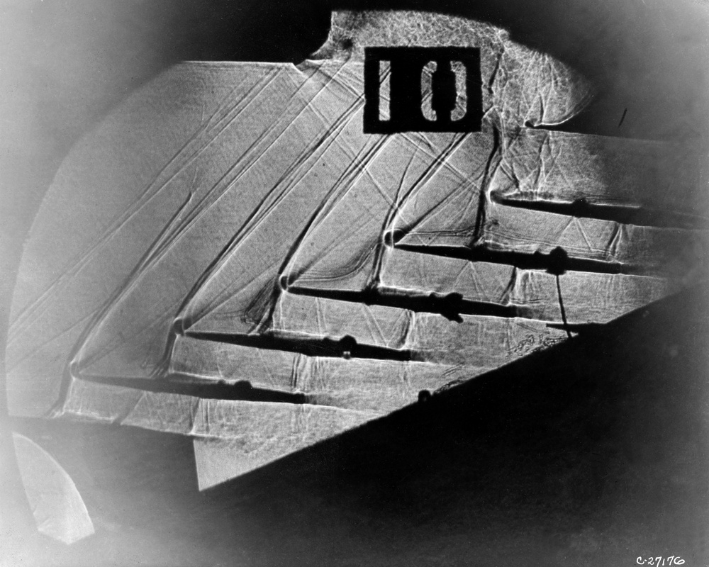 SHADOWGRAPH PICTURE OF CASCADE OF UNSTARTED SUPERSONIC BLADES