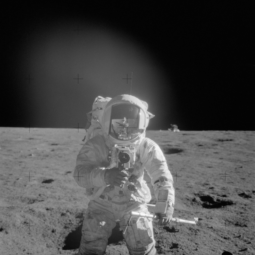 Apollo 12 Mission image  - Astronaut  Charles Conrad Jr., Apollo 12 commander, using a 70mm handheld Haselblad  camera