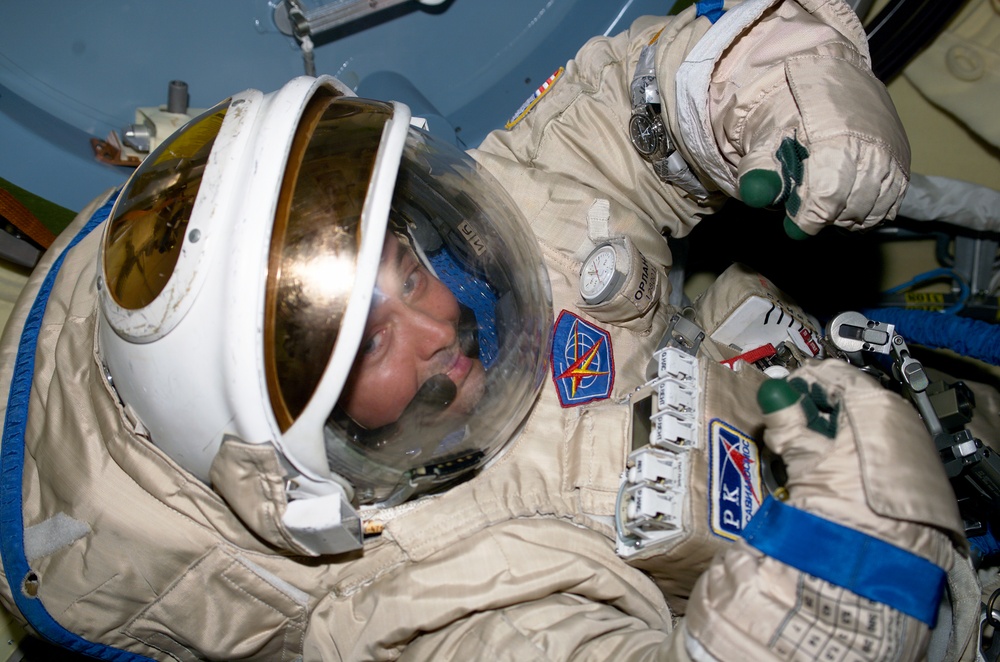 Bursch in Orlan suit during EVA 2 preparation in SM,  Expedition Four