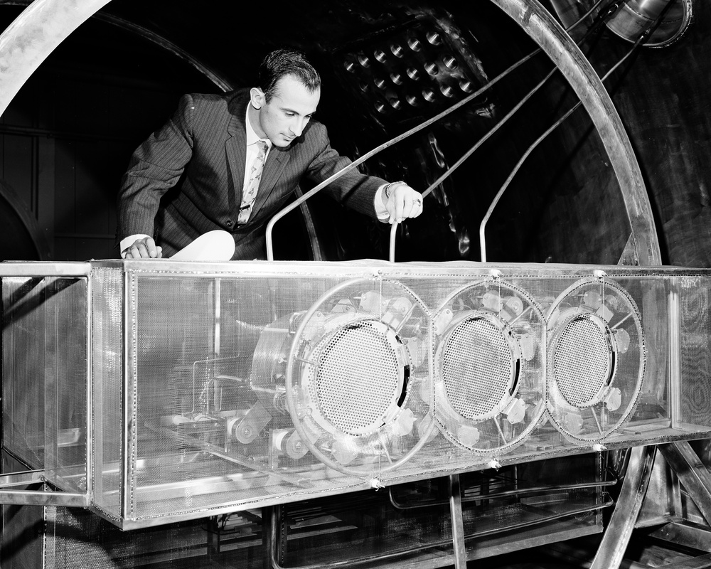 NEW EMPLOYEE ON JOB - PAUL M MARGESIAN CHECKING A CLUSTER OF ION ENGINES MOUNTED IN A 25 FOOT VACUUM TANK CHAMBER PRIOR TO TESTING