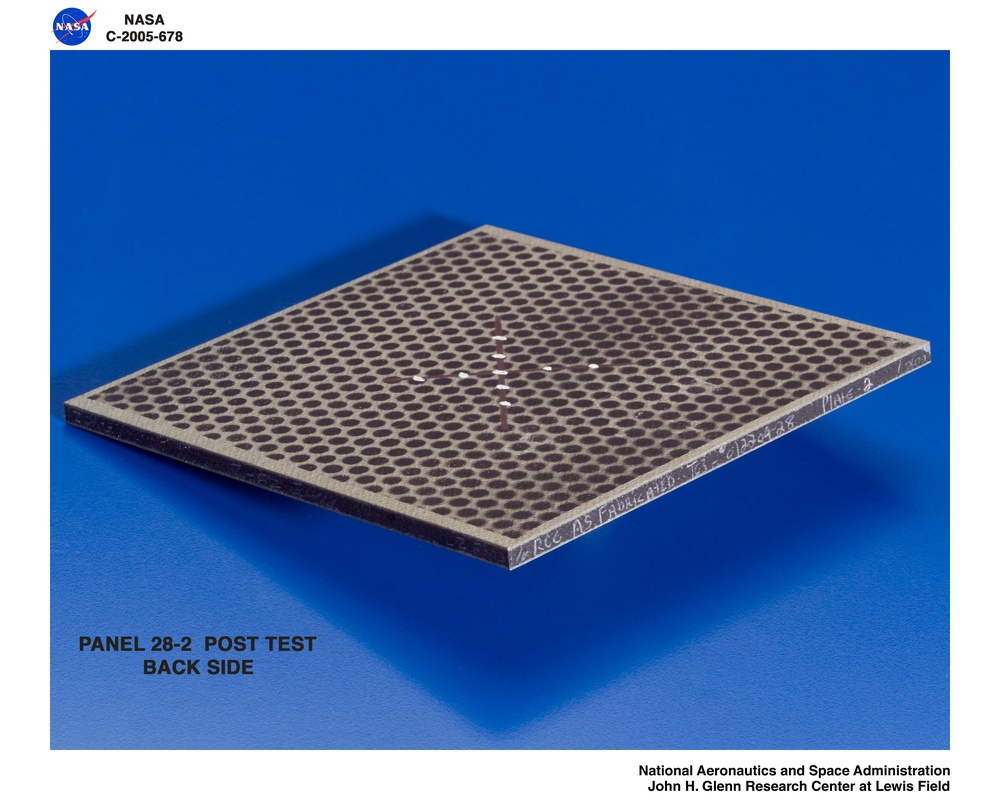 Panel 28-2 post test  RCC carbon / carbon fiber panels - the panels are space shuttle tile material being tested in the ballistics lab building 49