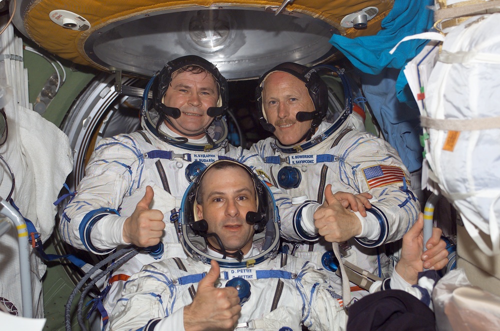 Expedition Six crewmembers pose in the FGB during Expedition Five on the ISS