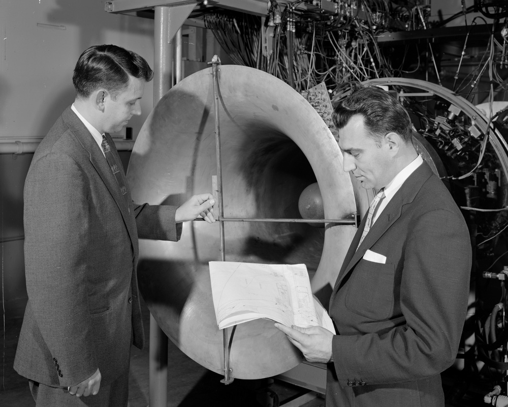 AERONAUTICAL RESEARCH SCIENTISTS ARTHUR MEDEIROS AND RICHARD GEYE AT WORK ON J-34 ENGINE WITH 5 STAGE TRANSONIC COMPRESSOR