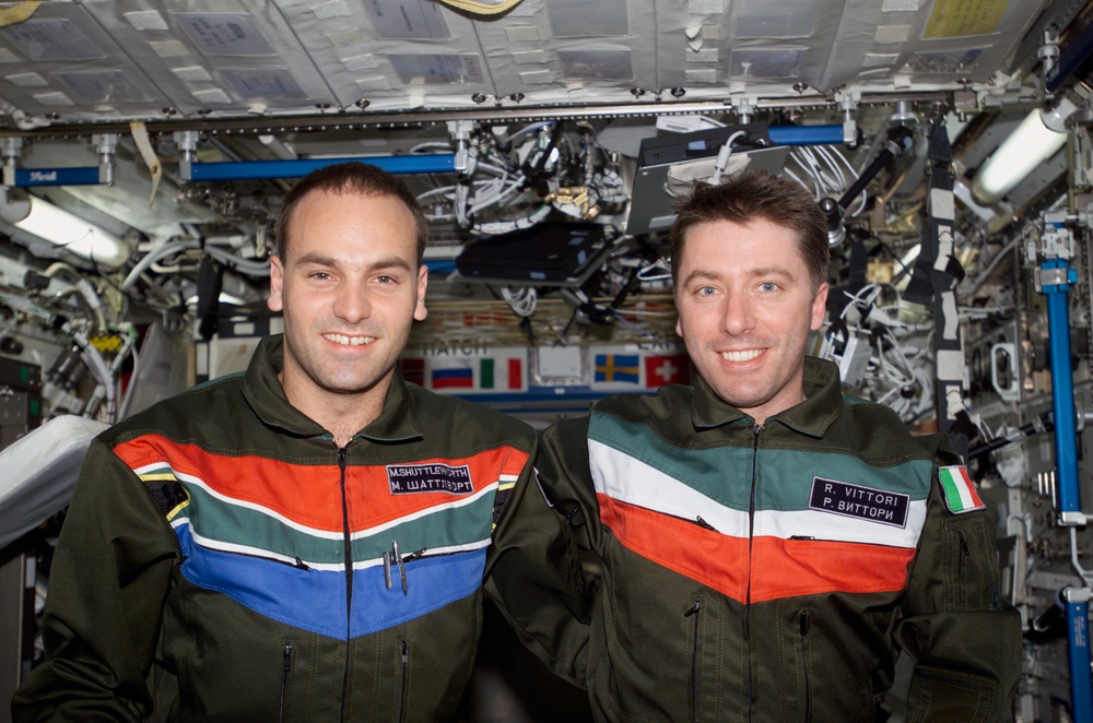 Shuttleworth and Vittori pose for a photo in U.S. Lab during Expedition Four