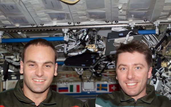 Shuttleworth and Vittori pose for a photo in U.S. Lab during Expedition Four