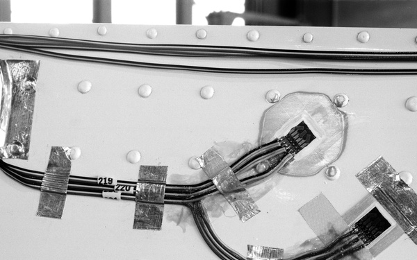 MOD-0 WIND TURBINE BLADE WITH STRAIN GAUGES INSTALLED AND MOD-0 WIND TURBINE TEST STAND