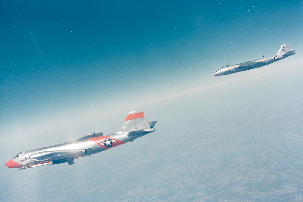 B-57A AIRPLANE AT HIGH ALTITUDE CARRYING MISSILE FOR DROP TESTS WITH CHASE PLANE B-57 FOLLOWING