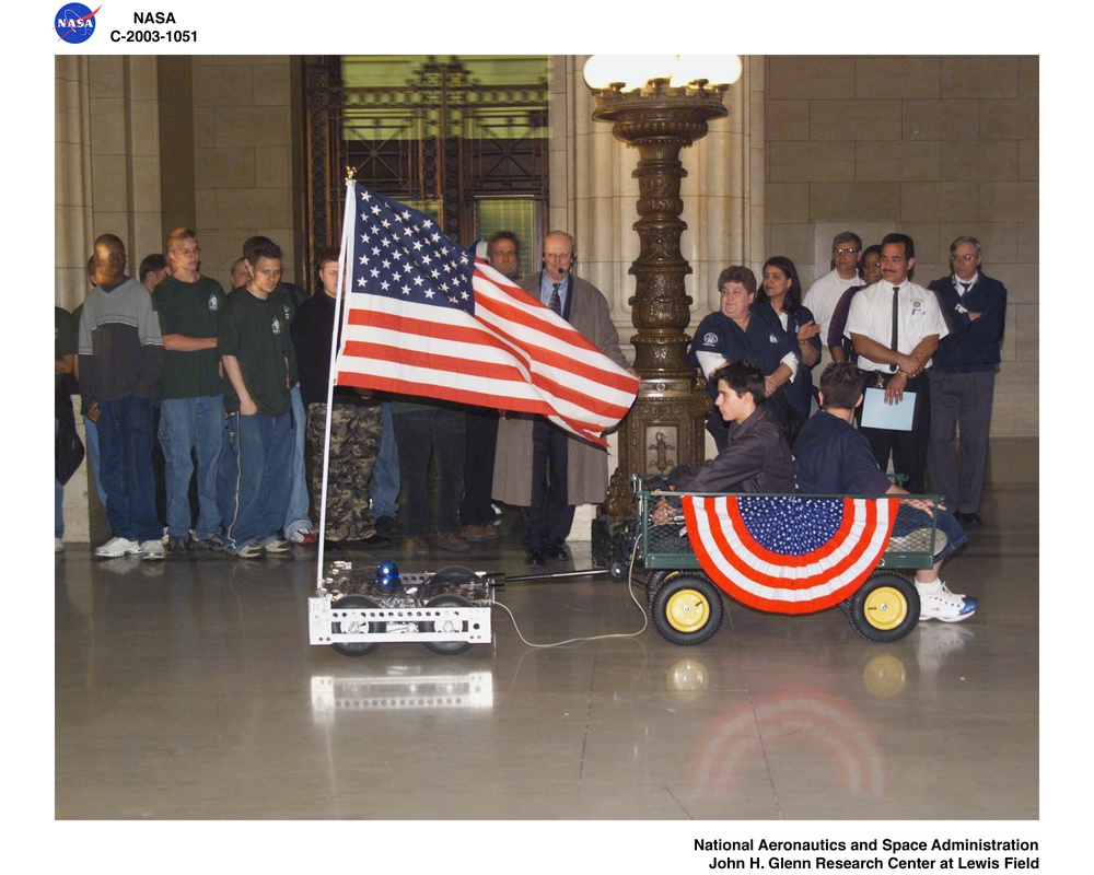 2003 FIRST (For Inspiration and Recognition of Science and Technology) Buckeye Regional Robotics Competition Recognition Ceremony - Max Hayes Vocational School Robot Carrying in the American flag