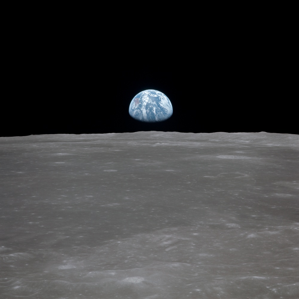 Apollo 11 Mission image - View of moon limb,with Earth on the horizon,Mare Smythii Region