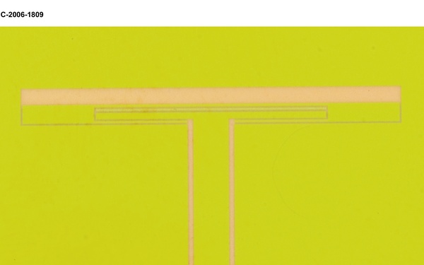 Dual Frequency Slot Antenna with SiC Thin Film Packaging Technology