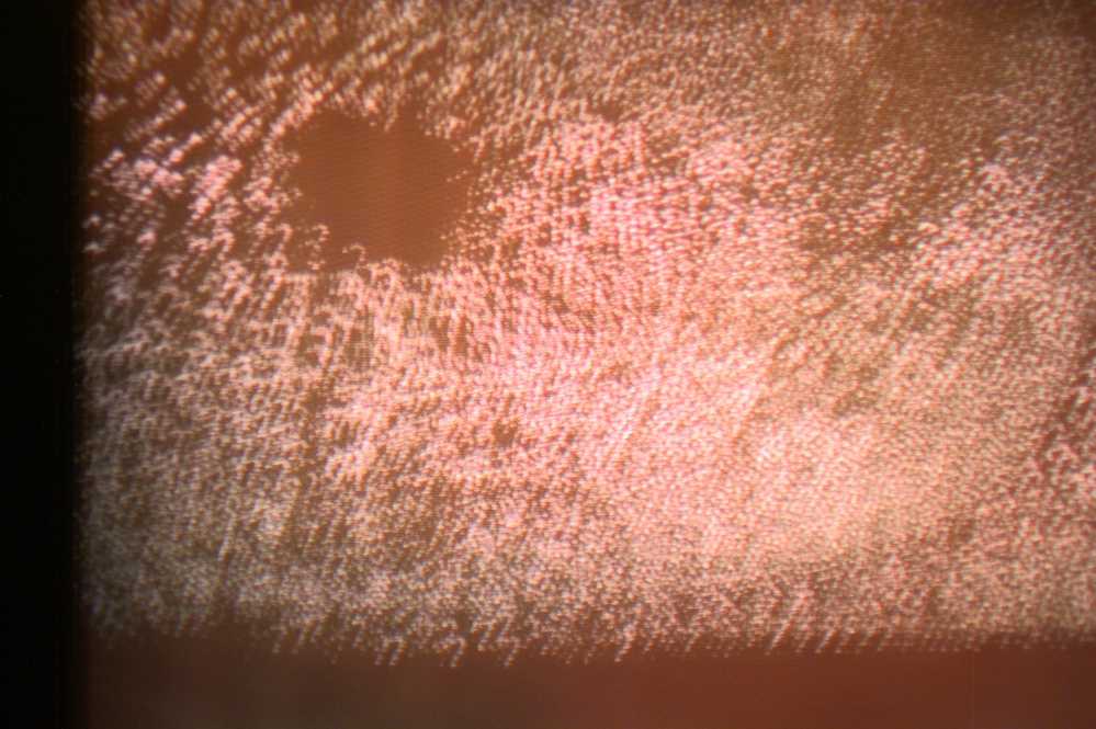 View of a monitor with a red screen taken during Expedition Three