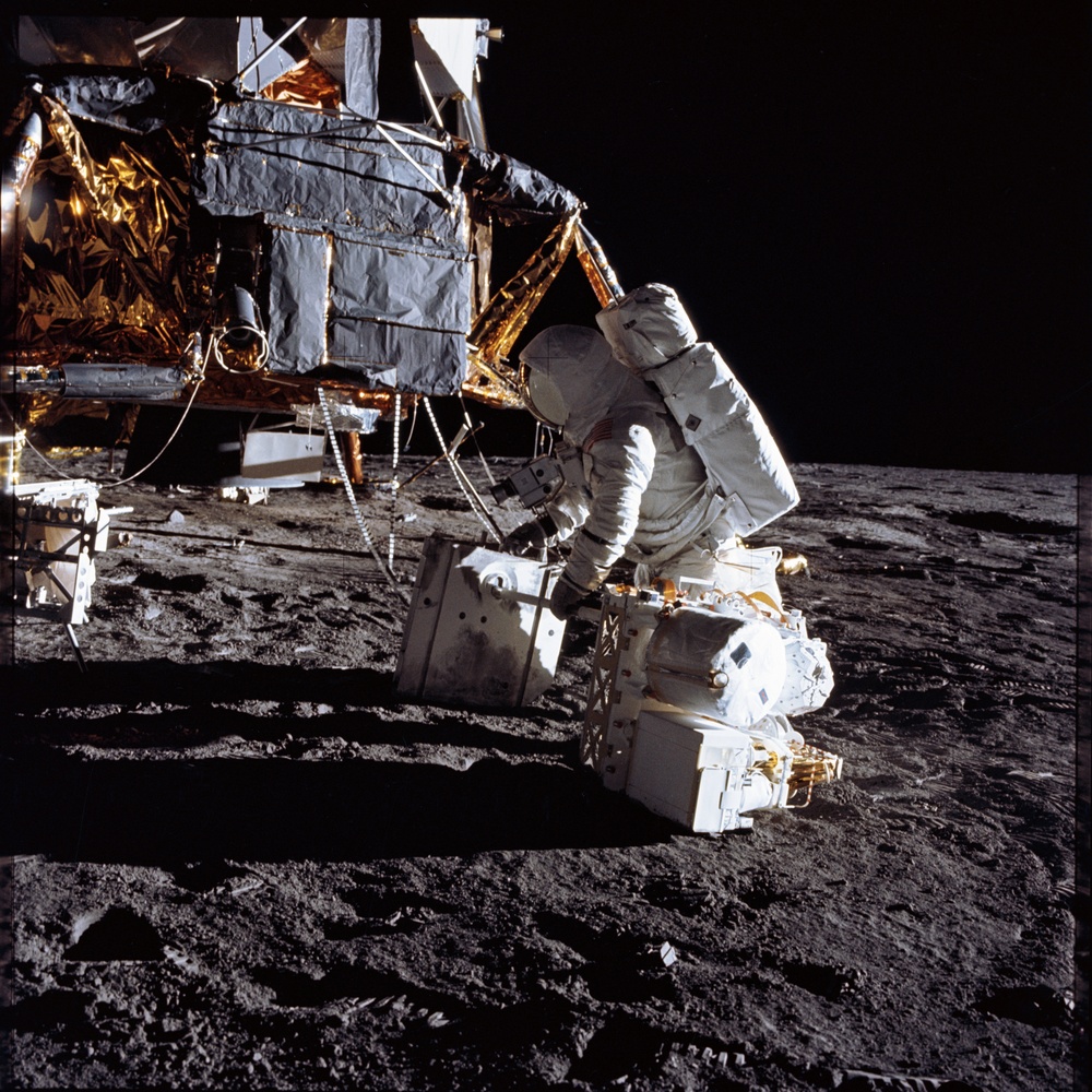 Apollo 12 Mission image  - Alan Bean unloads ALSEP RTG fuel element