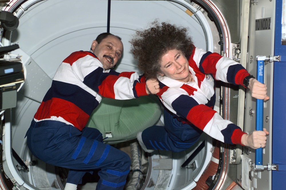 Yury Usachev and Susan Helms kid around during egress from the ISS