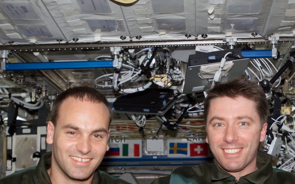 Shuttleworth and Vittori pose for a photo in U.S. Lab during Expedition Four