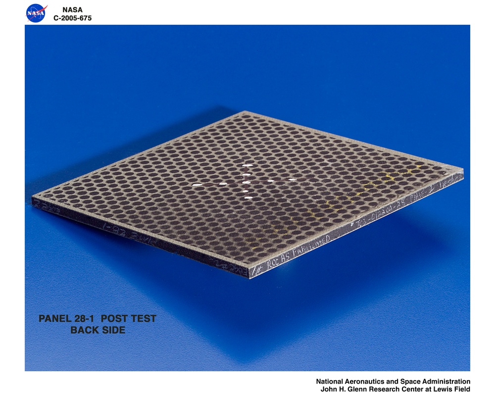 Panel 28-1 post test  RCC carbon / carbon fiber panels - the panels are space shuttle tile material being tested in the ballistics lab building 49