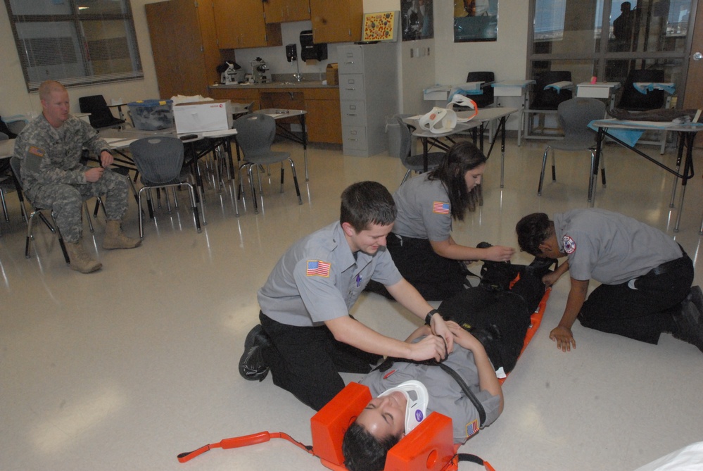 Members of the 81st Civil Affairs Battalion help teach EMT skills to high school students