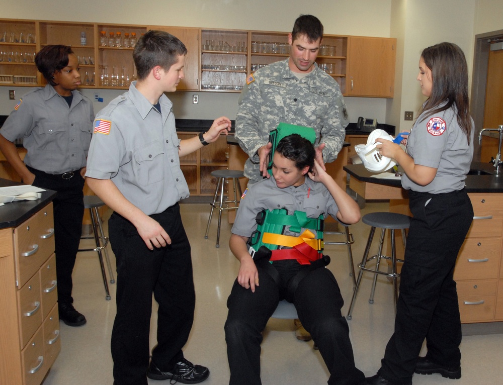 Members of the 81st Civil Affairs Battalion help teach EMT skills to high school students