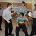 Members of the 81st Civil Affairs Battalion help teach EMT skills to high school students
