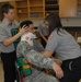 Members of the 81st Civil Affairs Battalion help teach EMT skills to high school students