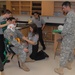 Members of the 81st Civil Affairs Battalion help teach EMT skills to high school students