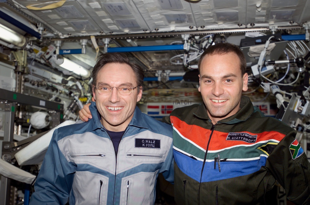 Walz and Shuttleworth pose for a photo in U.S. Lab during Expedition Four