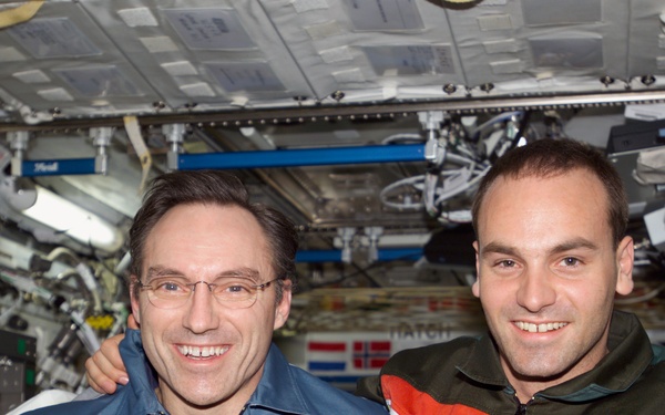 Walz and Shuttleworth pose for a photo in U.S. Lab during Expedition Four