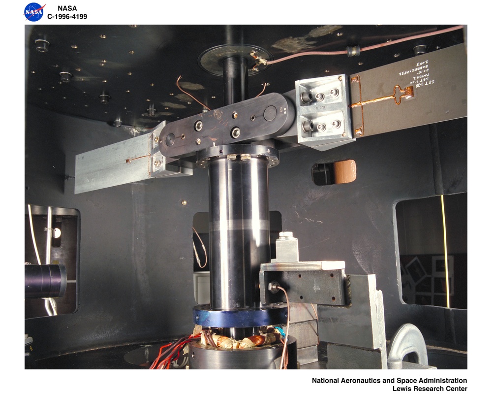 SPIN TEST OF VISCOELASTICALLY DAMPED COMPOSITE PLATES