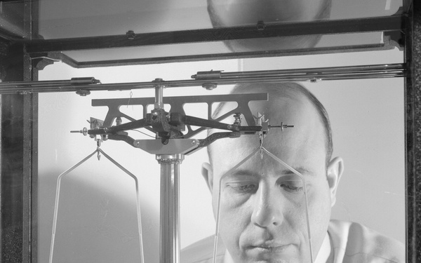 DR MYRON DAVIS WITH APPARATUS USED IN AN EXPERIMENTAL STUDY OF DIFFUSION IN OXIDES AT TEMPERATURES ABOVE 1000 DEGREES C AT THE BASIC MATERIALS LABORATORY BML BUILDING