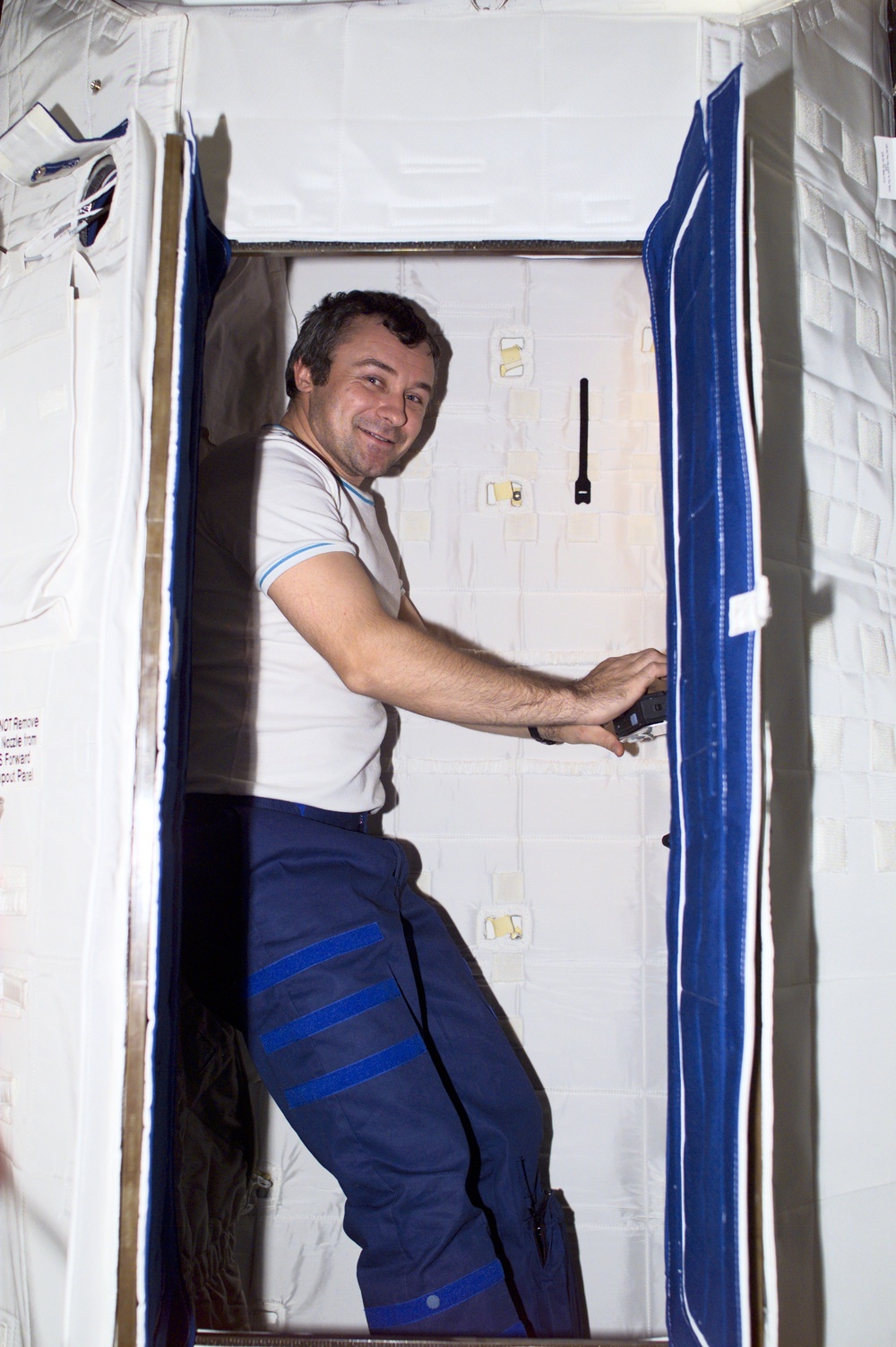 Dezhurov works in the sleep station in the U.S. Laboratory during Expedition Three